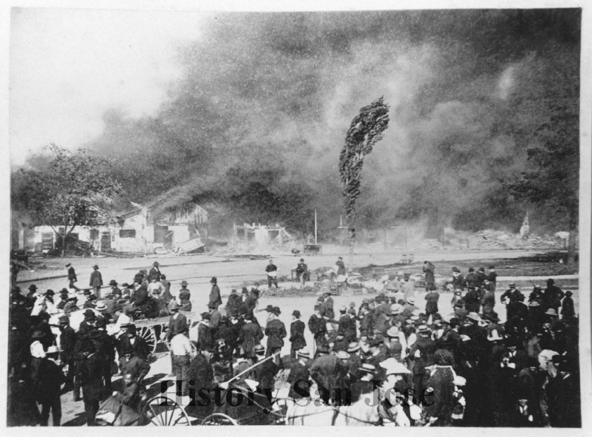Crowds watch a fire destroy Market Street Chinatown in San José in 1887