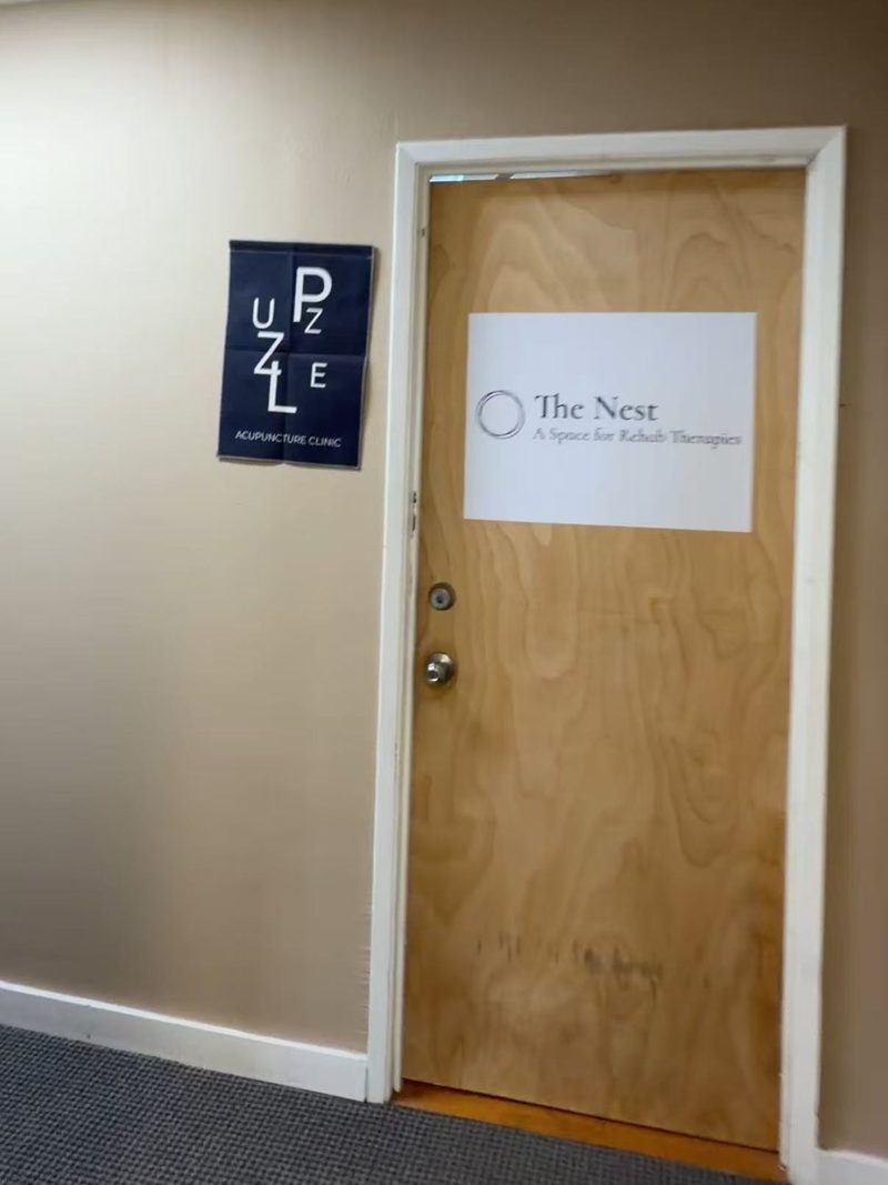 The second-floor hallway and the wooden door marked The Nest.