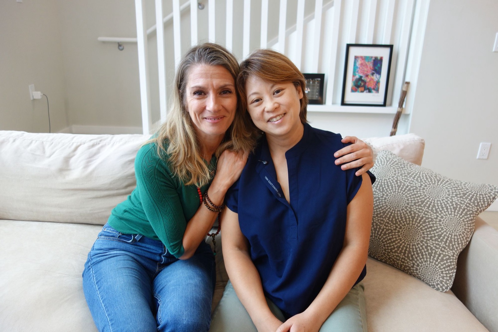 Dr Deb Ma embracing Berlinda, a San Francisco reflexologist, after a session together